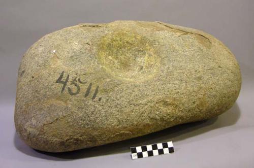 Mortar. somewhat ovoid, thick boulder with deep circular depression (13.3 x 5.0