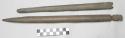 5 wooden weaving implements (?), carved: a) 1 double-pointed stick with 2 bird c