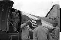 Men exiting an airplane