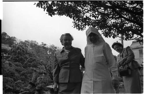 Nun and elderly lady smiling