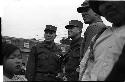 Three men in military uniform standing together