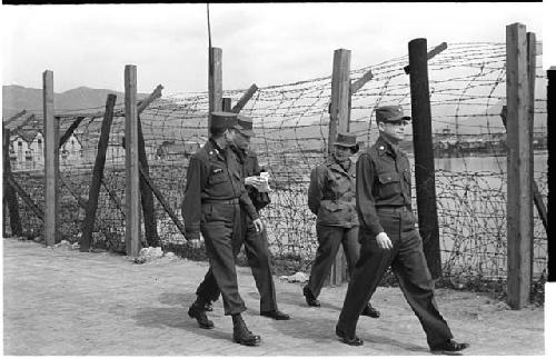 People walking in military uniform