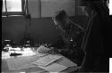 Man writing at a desk