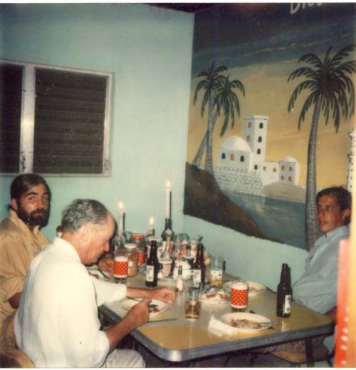 W. Fash, GR Willey, R. Leventhal eating in kitchen of field house