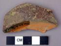 Undecorated lead glazed redware base sherd