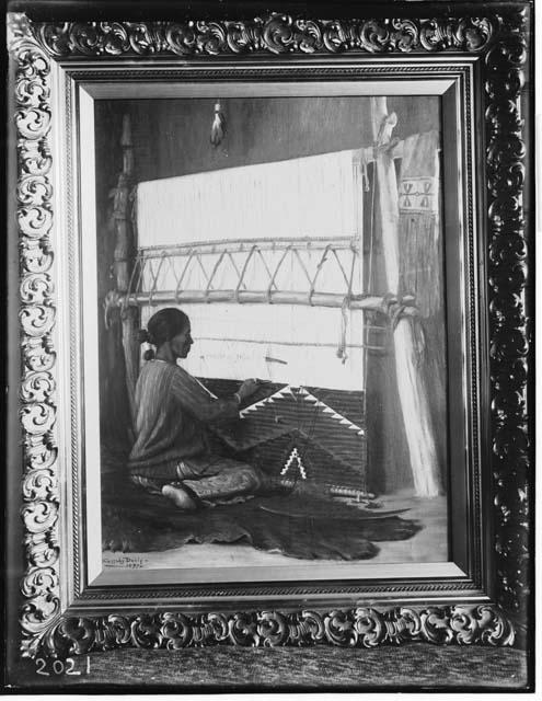 Navajo woman weaving inside hogan