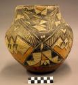 Acoma polychrome jar. Black and orange on white. Geometric and curvilinear desig