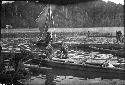 Men rowing a double outrigger dugout canoe