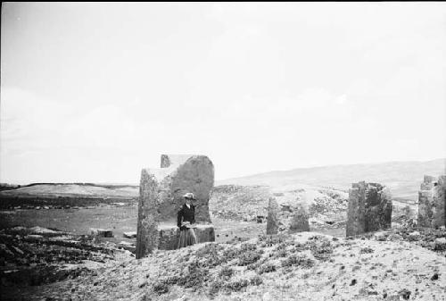 Woman standing in front of monolith