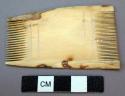 Ivory comb or weaving instrument; Comb cut from tusk of mammoth