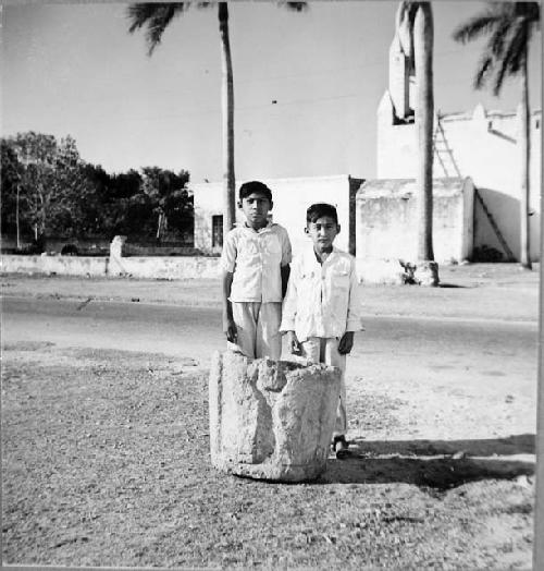 Fragment of sculptured column with two local boys for scale.