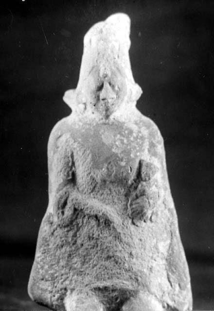 Ceramic? figurine, seated human. 0.6, IV, 27-Bis