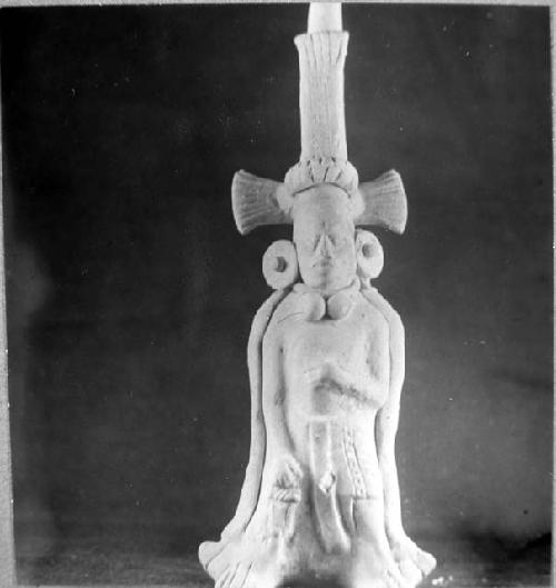 Ceramic figurine, standing male with headdress and cape