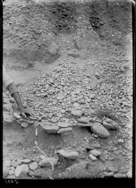 Cobble stones at foot of bank