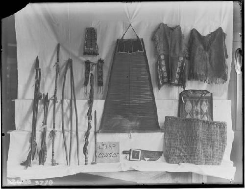 Bed of slats, walking stick, boy's suit