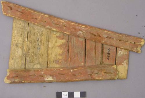 Painted wooden object, triangle of red painted slats tied together