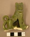 Cast of  metal ornament, lion effigy, broken off of a larger object.