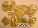 Ceramic rim and body sherds, various vessels, brown on buff geometric designs
