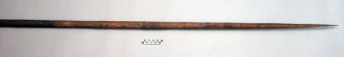 Wooden lance or fighting stick, ca. 5 ft. l, incised designs over half of surfac