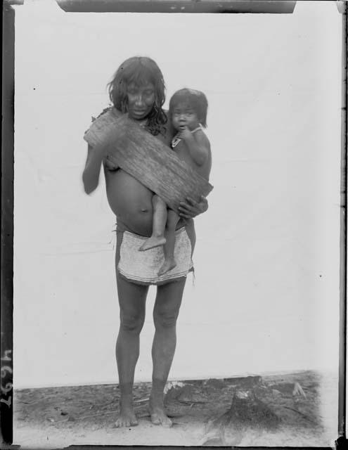 Woman carrying child