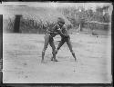 Two boys wrestling