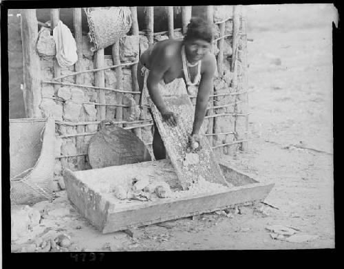 Girl grating cassava