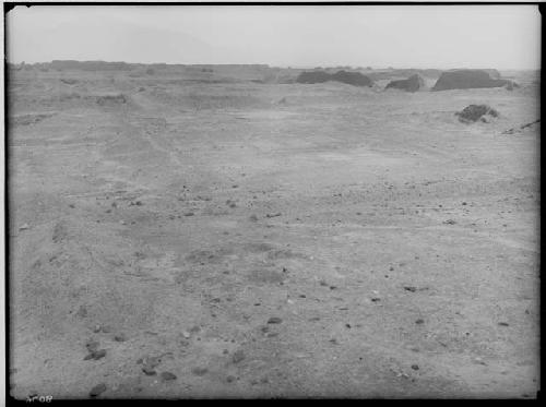 Tumbled walls and remains of "Yapus" of Tello group. Background, Uhle group