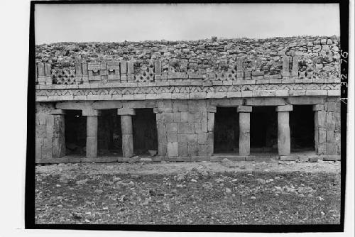 Upper story facade. East wing of structure 1, Rooms 59, 61