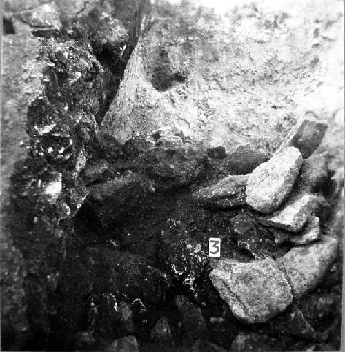 Stones found in trench into W side of Str. 1 from W and above.