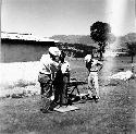 Dr. Charles Goff taking anthropological measurements on Zaculeu workmen.