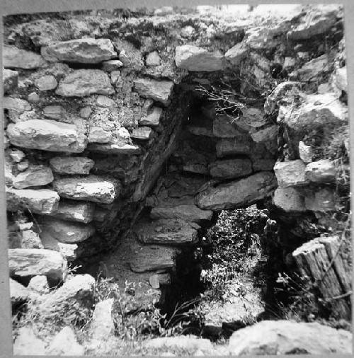 Detail from east of arch construction - two periods in stucco facade temple