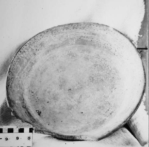 Fragmentary tetrapodal polychrome pottery bowl.