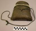 Basketry pouch containing spool of thread