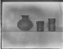 Three complete pottery vessels from tombs on display