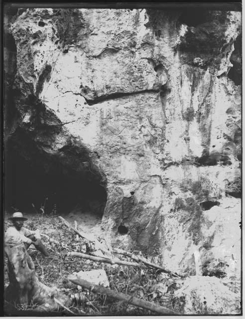 Sculpted figure at entrance to cave