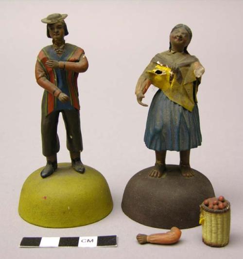 Painted plaster of paris figures of an Indian couple