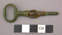 Metal, hardware, key, oval head, cylindrical shaft, corroded in middle