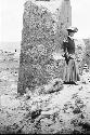 Woman standing near monolith