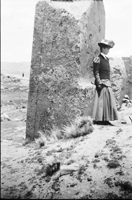 Woman standing near monolith