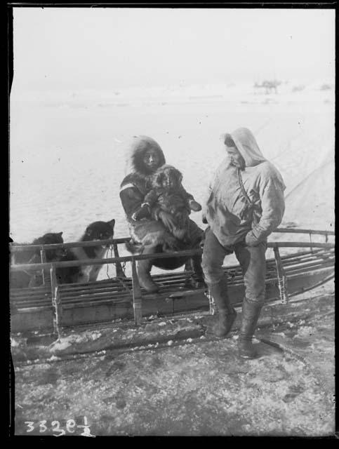 Uikshruk, Tullek, and Nagorook with sled and dogs