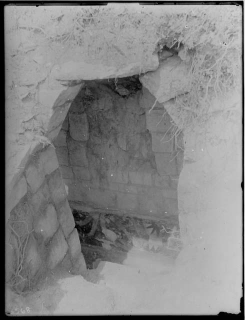 Looking down into subterranean chamber, Mound of the Painted Columns