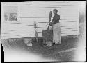 Seneca woman pounding corn meal