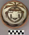 Bowl, polacca polychrome style c. int: kachina design; ext: slipped, no design.