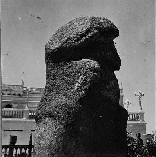 Large stone figure (right profile)