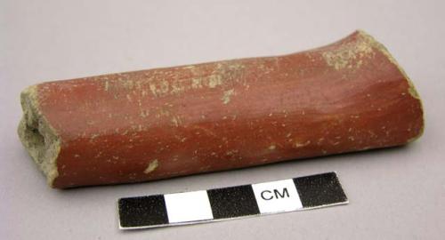 Red polished pottery pipe stem