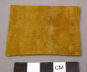 Buckskin dyed, full red treatment after which black is applied