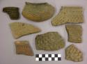 Ceramic sherds, corrugated body and rim, some from jar