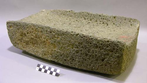 Metate. rectangular large cobble. fairly square bottom & straight sides open-end