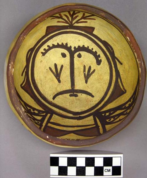 Bowl, polacca polychrome style c. int: clown design; ext: slipped, no design. 6.