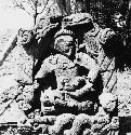 Sculptured figure seated cross-legged (maize god?)